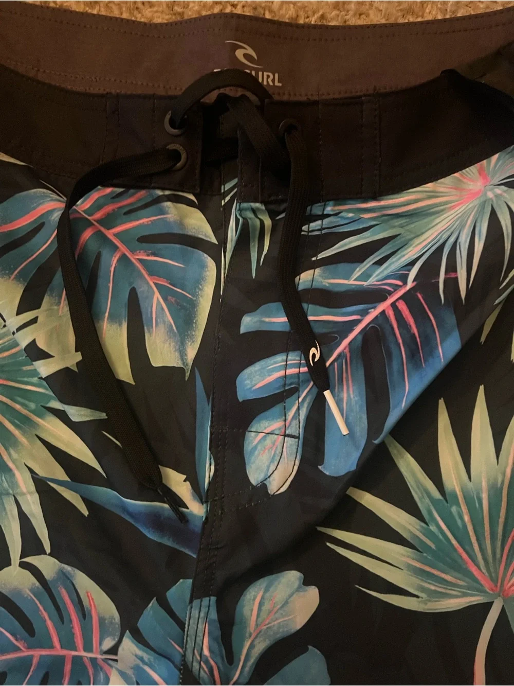 Rip Curl Black Swim Shorts with Blue-Green Tropical Leaves